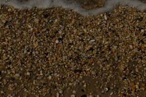 I loved the look of the ocean coming into the beach here. The sea foam slowly washing over the pretty pebbles some of which look like gems and are translucent all very smooth from being tumbled. photo