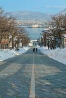Hachiman Zaka Slope with Snow in winter season. landmark and popular for attractions in Hokkaido, Japan. Travel and Vacation concept photo