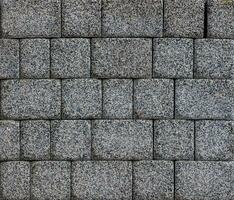flat texture and full-frame background of gray cuboid brick pavement photo