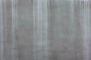 concrete outdoor wall with matte gray paint and white smudges - full-frame background and flat texture photo