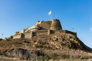 Gori Fortress is a medieval citadel in Georgia, situated above the city of Gori on a rocky hill. Standing on the hilltop photo