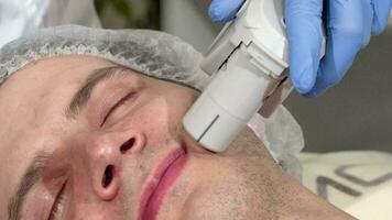 Man getting ultrasound skin treatment at beauty clinic video