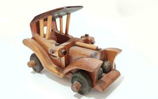 handmade wooden toy car on a white background photo