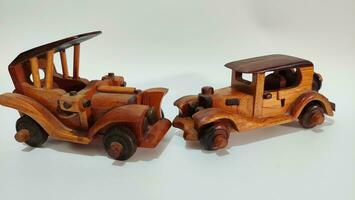 handmade wooden toy car on a white background photo