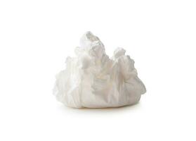 Single screwed or crumpled tissue paper or napkin in strange shape after use in toilet or restroom isolated on white background with clipping path photo