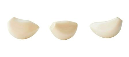 Set of three separated peeled garlic cloves isolated on white background with clipping path. photo