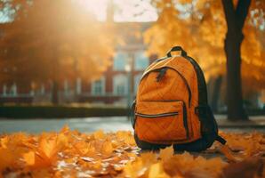 Orange school backpack in autumnal park. Generate ai photo