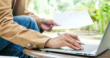 Freelance work concept. Confident busy freelancer in trendy eyewear doing remote job  in workplace photo