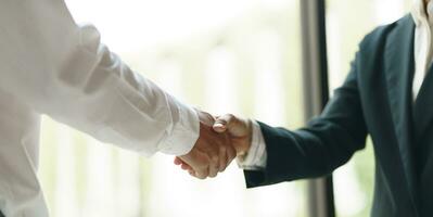 Businessman shaking hands successful making a deal. mans handshake. Business partnership meeting concept photo