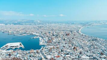 Beautiful landscape and cityscape from Hakodate Mountain with Snow in winter season. landmark and popular for attractions in Hokkaido, Japan.Travel and Vacation concept photo