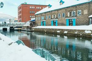 Otaru canal with Snow in winter season. landmark and popular for attractions in Hokkaido, Japan. Travel and Vacation concept photo