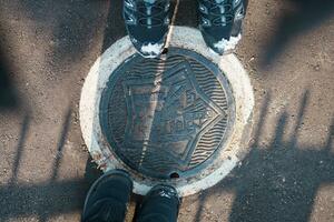 Hakodate city manhole cover with snow in winter season. Hakodate in one of landmark and popular for tourists attractions in Hokkaido, Japan. Travel and Vacation concept photo