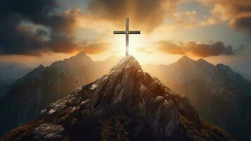 a cross on a mountain with the sun shining on it photo