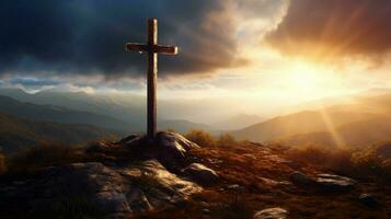 a cross on a mountain with the sun shining on it photo