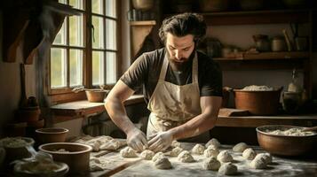 a man kneading dough in a homemade kitchen photo