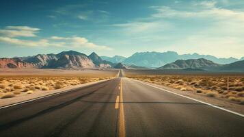 a road in the desert with mountains in the background photo