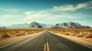 a road in the desert with mountains in the background photo