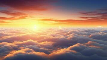 a sunset above the clouds with the sun setting behind it photo
