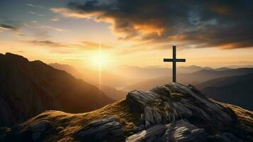 christian cross on majestic mountain peak at sunset photo