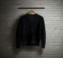 Black sweater mockup with brick background ai generate photo