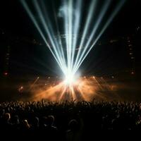 glowing stage light illuminates cheering rock fans photo