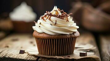 homemade chocolate cupcake with creamy icing on rustic wooden table photo