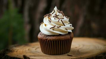 homemade chocolate cupcake with creamy icing on rustic wooden table photo