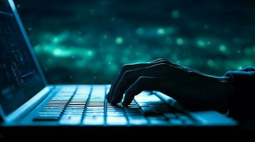 human hand typing on computer keyboard at night photo
