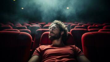 man watching movie in theater seats spectacle photo