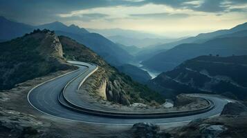 mountain landscape at dusk asphalt curves ahead adventurous photo