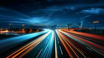 nighttime traffic blurs along dark multiple lane highway photo