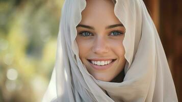 one young woman religious veil smiling outdoors photo