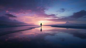 silhouette walking on serene beach at dusk photo