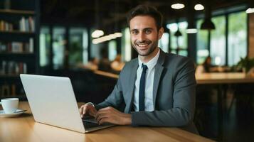 smiling businessman indoors looking at camera working on photo