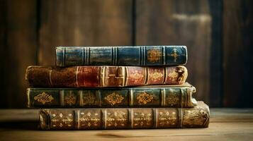 stack of old books on wooden table photo