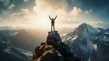 standing triumphantly atop rocky mountain peak arms raise photo