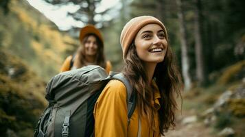 young women enjoying nature hiking in the forest smiling photo