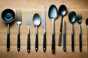 a collection of black and silver utensils on a wooden surface. AI-Generated photo