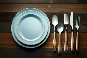 a plate, fork, knife and spoon on a wooden table. AI-Generated photo