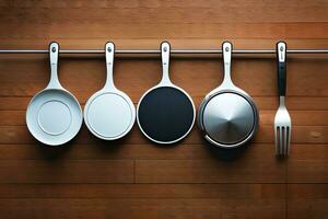 five different utensils hanging on a rack. AI-Generated photo