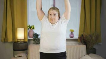 Obesity woman doing exercises at home. video