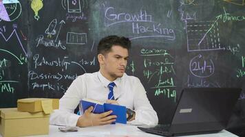 Businessman writes Growth hacking on the board and comes up with new idea. video