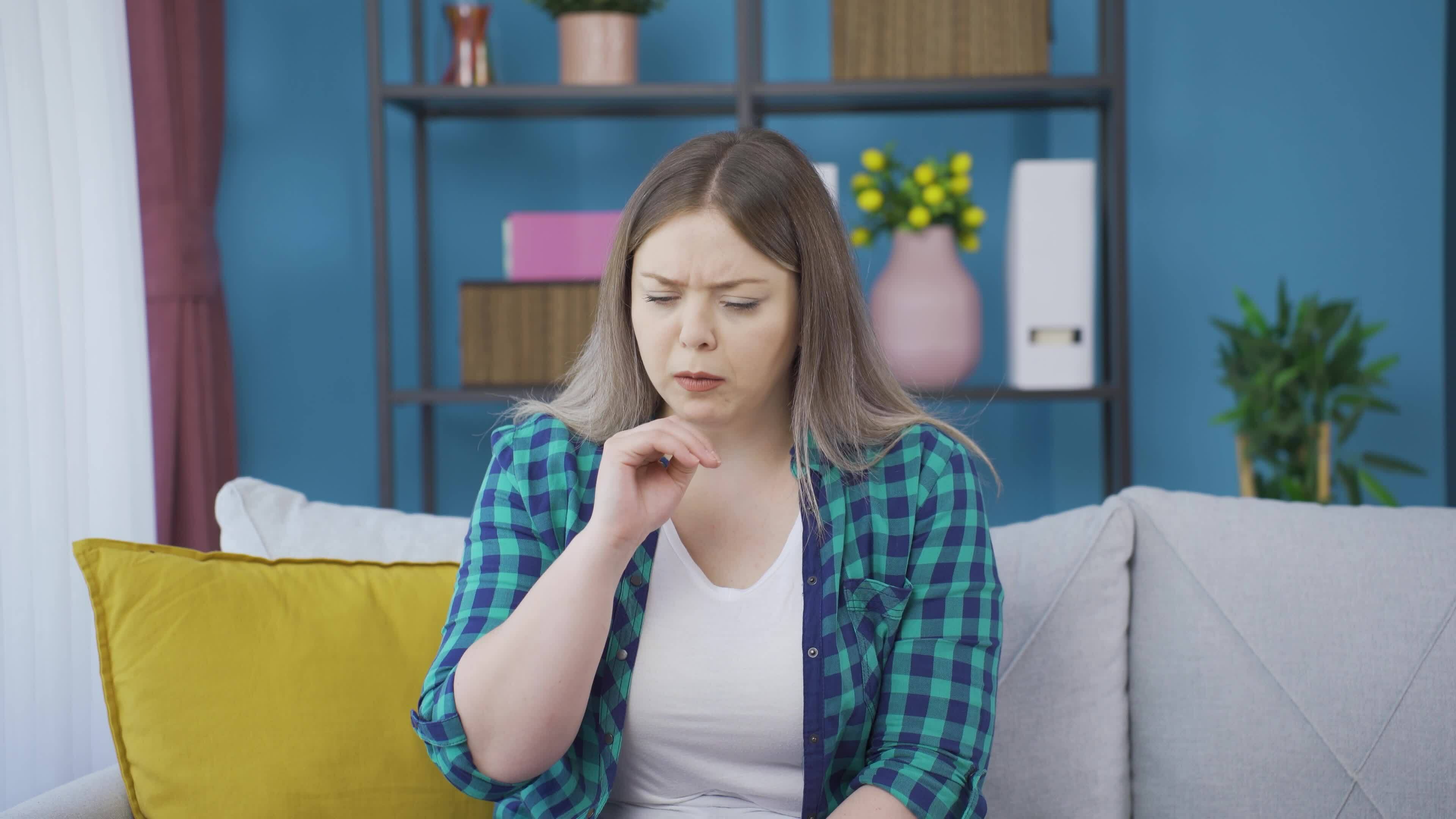 The sick woman can't stop coughing. 32965342 Stock Video at Vecteezy