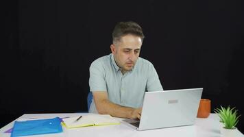 Man closing laptop with angry expression. video