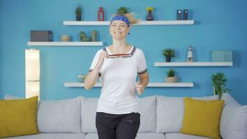 Woman jogging at home. Fitness is running. video