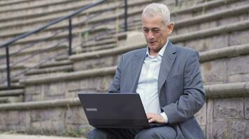 Happy man using laptop. video