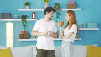 Happy couple enjoying coffee at home. video