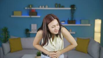 Young woman experiencing stomachache. video