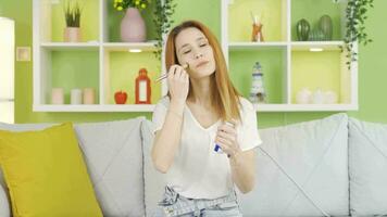 Young woman wearing make-up is happy. video