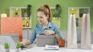 A woman browsing and researching online shopping sites to buy new products. video